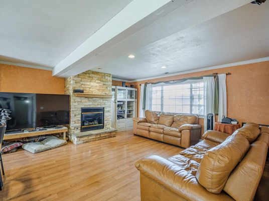 Fireplace, Interior, Living room, Recessed Lighting, Stone Walls, Wood Texture Flooring