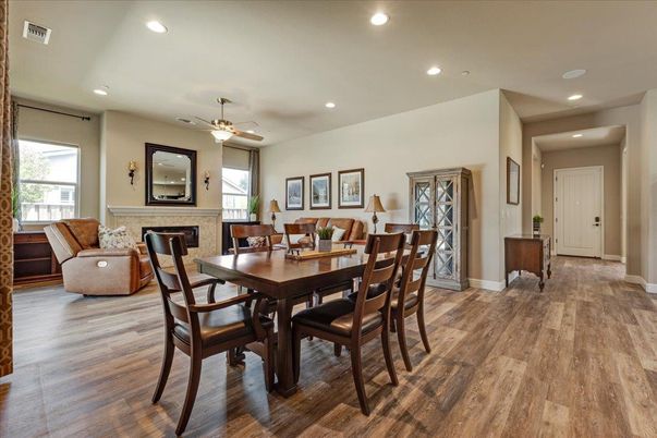 Dining room, Fireplace, Interior, Living room, Recessed Lighting, Wood Texture Flooring