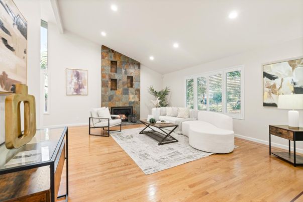 Fireplace, Interior, Living room, Recessed Lighting, Stone Walls, Wood Texture Flooring