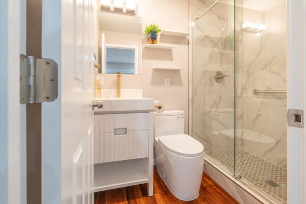 Bathroom, Glass Shower, Interior, Marble Walls, Wood Texture Flooring
