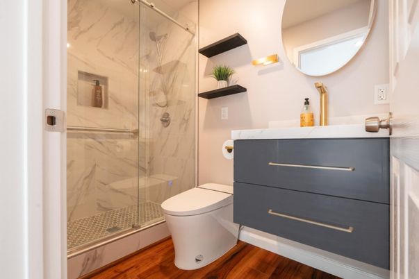 Bathroom, Glass Shower, Interior, Marble Walls, Wood Texture Flooring