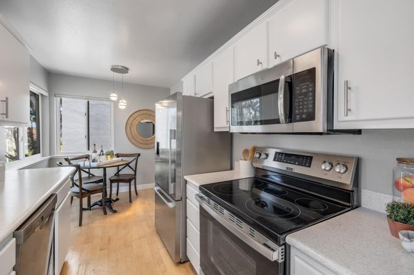 Dining room, Interior, Kitchen, Pendant Lights, Stainless Steel Appliances, Wood Texture Flooring