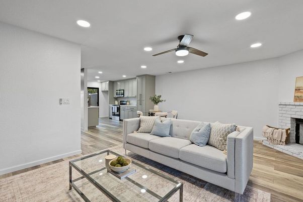 Dining room, Fireplace, Interior, Kitchen, Living room, Recessed Lighting, Stainless Steel Appliances, Wood Texture Flooring