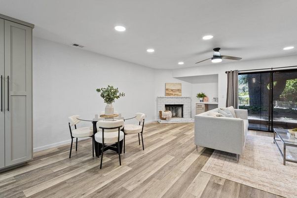 Dining room, Fireplace, Interior, Living room, Recessed Lighting, Wood Texture Flooring