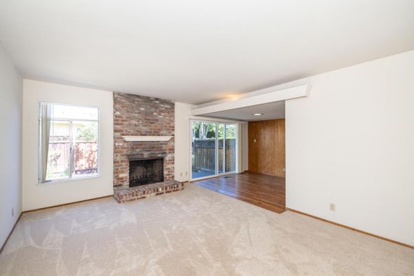 Empty room, Fireplace, Interior, Recessed Lighting, Stone Walls, Wood Texture Flooring