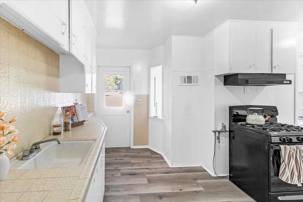 Interior, Kitchen, Tile Countertops, Wood Texture Flooring