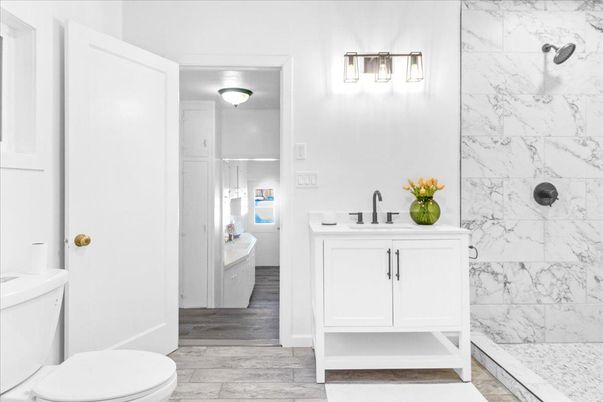 Bathroom, Glass Shower, Interior, Marble Walls, Wood Texture Flooring