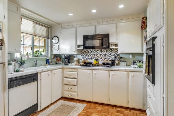 Interior, Kitchen, Recessed Lighting, Tile Countertops, Wood Texture Flooring