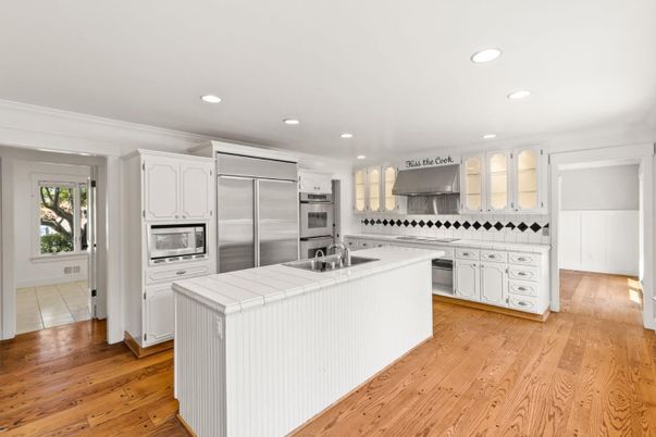 Interior, Kitchen, Recessed Lighting, Stainless Steel Appliances, Tile Countertops, Wood Texture Flooring