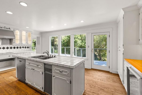 Interior, Kitchen, Recessed Lighting, Tile Countertops, Wood Texture Flooring