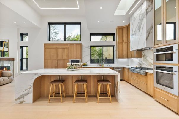 Interior, Kitchen, Marble Walls, Recessed Lighting, Stainless Steel Appliances, Wood Texture Flooring