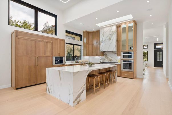 Interior, Kitchen, Marble Walls, Recessed Lighting, Stainless Steel Appliances, Wood Texture Flooring