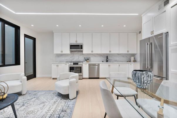 Dining room, Interior, Kitchen, Marble Walls, Recessed Lighting, Stainless Steel Appliances, Wood Texture Flooring