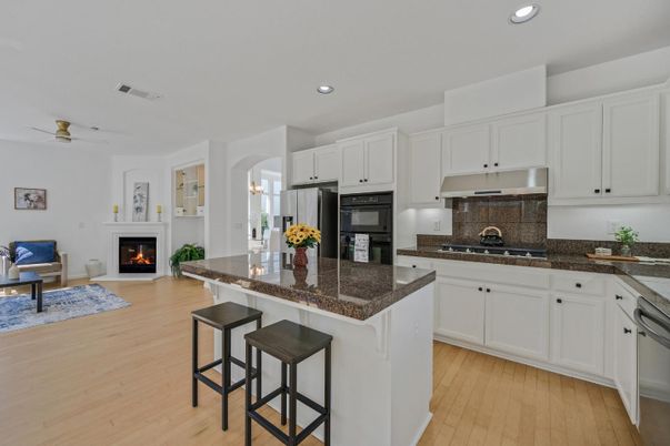 Fireplace, Interior, Kitchen, Living room, Recessed Lighting, Wood Texture Flooring