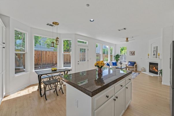 Dining room, Fireplace, Interior, Living room, Pendant Lights, Recessed Lighting, Wood Texture Flooring