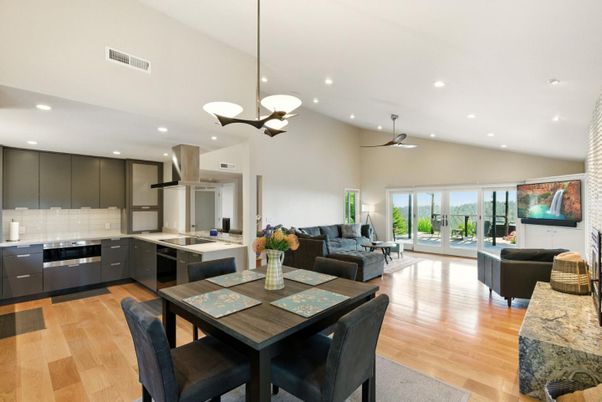 Chandelier, Dining room, Interior, Kitchen, Living room, Pendant Lights, Recessed Lighting, Stainless Steel Appliances, Wood Texture Flooring