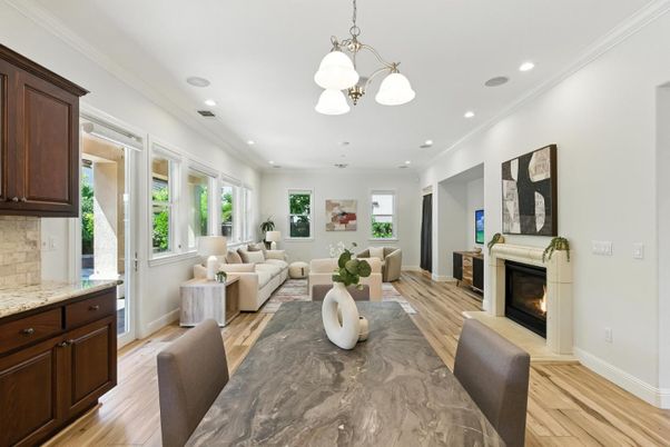 Dining room, Fireplace, Interior, Living room, Pendant Lights, Recessed Lighting, Wood Texture Flooring