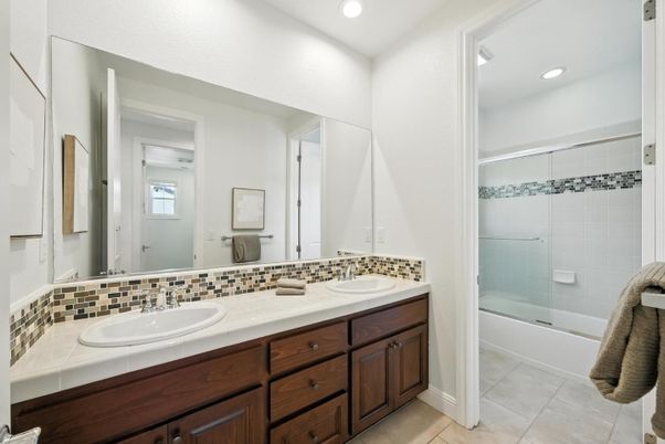 Bathroom, Dual Sink Vanities, Glass Shower, Interior, Recessed Lighting, Tile Countertops