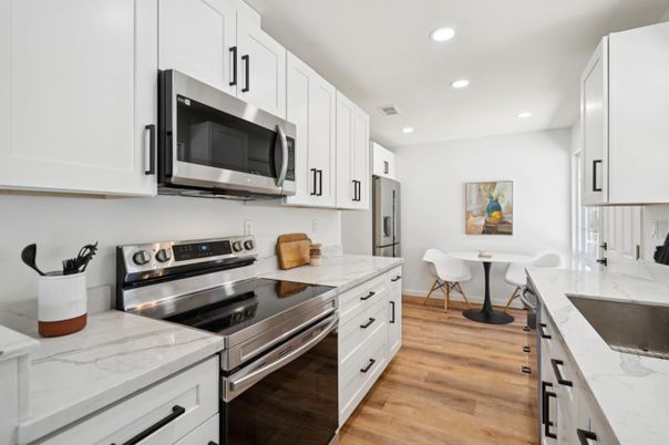 Dining room, Interior, Kitchen, Recessed Lighting, Stainless Steel Appliances, Wood Texture Flooring
