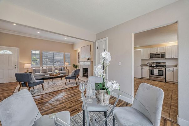 Dining room, Fireplace, Interior, Kitchen, Living room, Recessed Lighting, Stainless Steel Appliances, Wood Texture Flooring