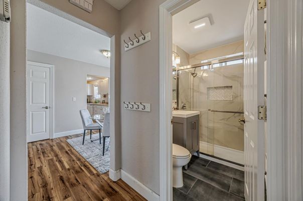 Bathroom, Glass Shower, Interior, Marble Walls, Wood Texture Flooring