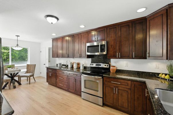 Dining room, Interior, Kitchen, Pendant Lights, Recessed Lighting, Stainless Steel Appliances, Wood Texture Flooring