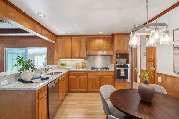 Dining room, Interior, Kitchen, Pendant Lights, Recessed Lighting, Stainless Steel Appliances, Wood Texture Flooring