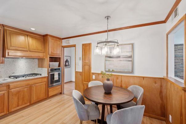 Dining room, Interior, Kitchen, Pendant Lights, Recessed Lighting, Stainless Steel Appliances, Wood Texture Flooring