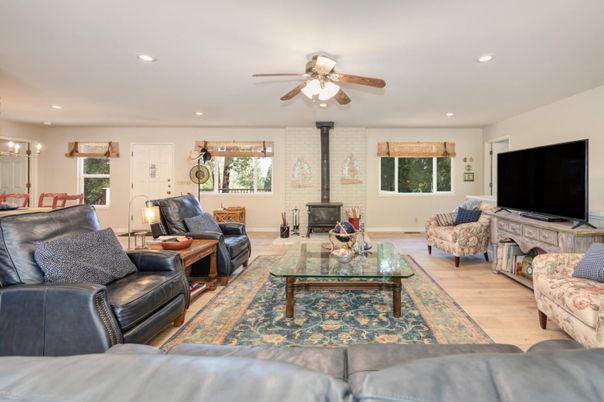 Fireplace, Interior, Living room, Recessed Lighting, Stone Walls, Wood Texture Flooring