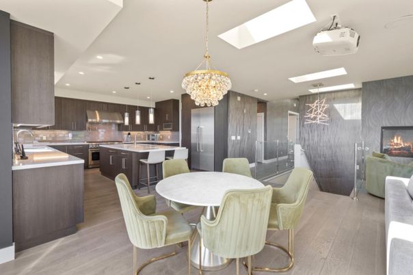Chandelier, Dining room, Fireplace, Interior, Kitchen, Living room, Pendant Lights, Recessed Lighting, Stainless Steel Appliances, Wood Texture Flooring