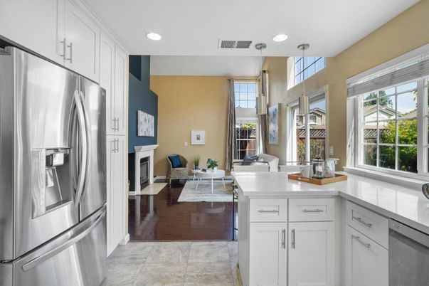 Fireplace, Interior, Kitchen, Living room, Pendant Lights, Recessed Lighting, Stainless Steel Appliances, Wood Texture Flooring