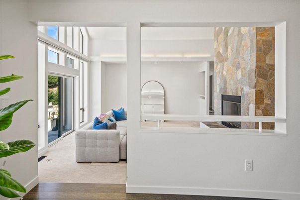 Fireplace, Interior, Living room, Recessed Lighting, Stone Walls, Wood Texture Flooring