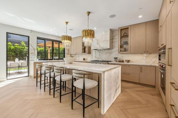 Chandelier, Interior, Kitchen, Marble Walls, Pendant Lights, Recessed Lighting, Stainless Steel Appliances, Wood Texture Flooring