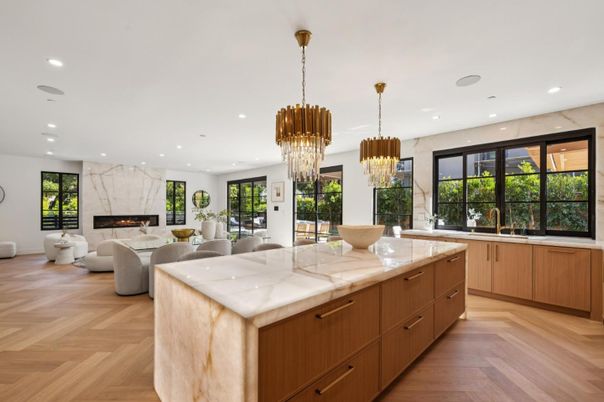Chandelier, Dining room, Fireplace, Interior, Kitchen, Living room, Marble Walls, Recessed Lighting, Wood Texture Flooring