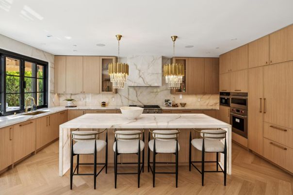 Chandelier, Interior, Kitchen, Marble Walls, Pendant Lights, Recessed Lighting, Stainless Steel Appliances, Wood Texture Flooring