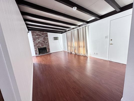 Empty room, Fireplace, Interior, Stone Walls, Wooden Beams, Wood Texture Flooring