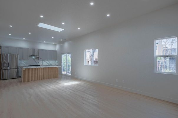 Interior, Kitchen, Marble Walls, Recessed Lighting, Stainless Steel Appliances, Wood Texture Flooring