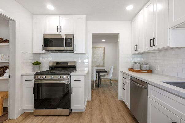 Dining room, Interior, Kitchen, Recessed Lighting, Stainless Steel Appliances, Wood Texture Flooring