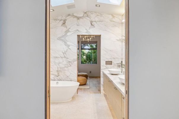 Bathroom, Dual Sink Vanities, Free Standing Baths, Interior, Marble Walls, Recessed Lighting, Wood Texture Flooring