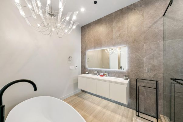 Bathroom, Chandelier, Dual Sink Vanities, Free Standing Baths, Interior, Recessed Lighting, Wood Texture Flooring