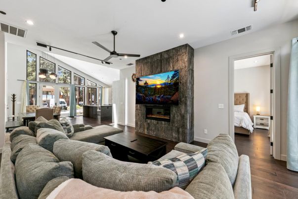 Bedroom, Fireplace, Interior, Living room, Pendant Lights, Recessed Lighting, Wood Texture Flooring