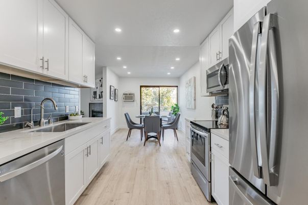 Dining room, Interior, Kitchen, Recessed Lighting, Stainless Steel Appliances, Wood Texture Flooring