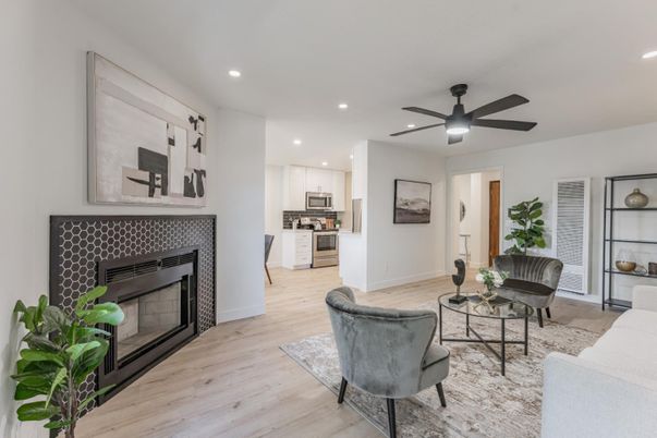 Fireplace, Interior, Kitchen, Living room, Recessed Lighting, Stainless Steel Appliances, Wood Texture Flooring