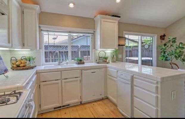Interior, Kitchen, Recessed Lighting, Tile Countertops, Wood Texture Flooring