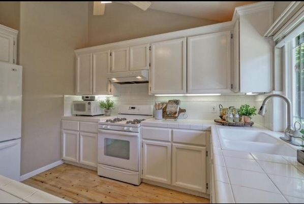 Interior, Kitchen, Tile Countertops, Wood Texture Flooring