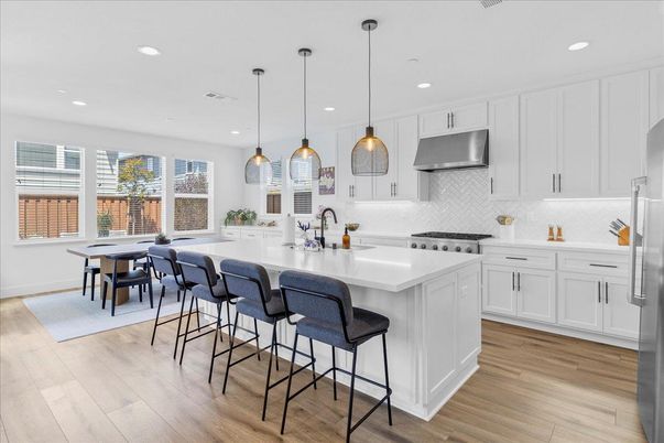 Dining room, Interior, Kitchen, Pendant Lights, Recessed Lighting, Stainless Steel Appliances, Wood Texture Flooring