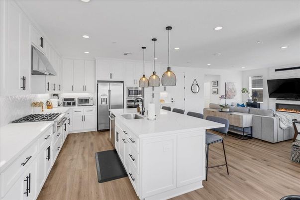 Fireplace, Interior, Kitchen, Living room, Pendant Lights, Recessed Lighting, Stainless Steel Appliances, Wood Texture Flooring