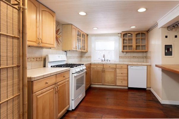 Interior, Kitchen, Recessed Lighting, Tile Countertops, Wood Texture Flooring
