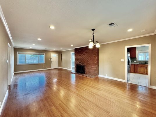 Empty room, Fireplace, Interior, Pendant Lights, Recessed Lighting, Stone Walls, Wood Texture Flooring