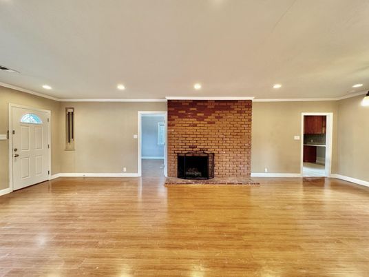 Empty room, Fireplace, Interior, Recessed Lighting, Stone Walls, Wood Texture Flooring